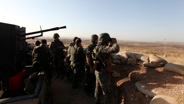 Kurdish Peshmerga forces keep watch in a village east of Mosul, Iraq, May 29, 2016. Kurdish Peshmerga forces keep watch in a village east of Mosul, Iraq, May 29, 2016. - Sputnik International