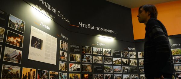 Photographic exhibition of MIA Rossiya Segodnya news agency photo correspondent Andrei Stenin killed in Ukraine on professional duty. - Sputnik International