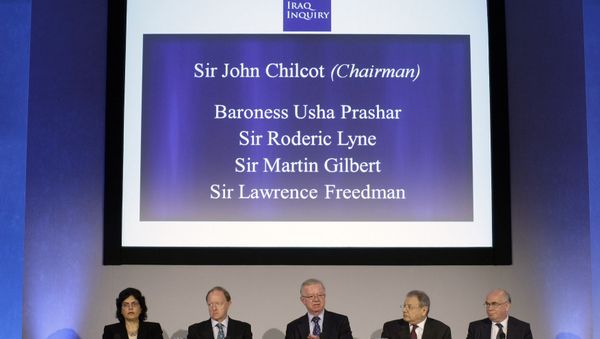 John Chilcot, center, the chairman of the Iraq Inquiry, sits with committee members John Chilcot, center, the chairman of the Iraq Inquiry, sits with committee members - Sputnik International