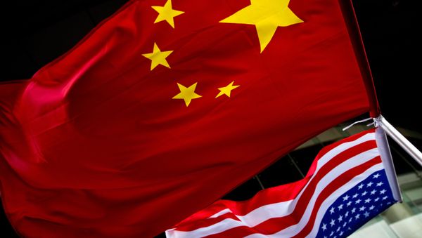 In this Nov. 7, 2012 photo, US and Chinese national flags are hung outside a hotel during the U.S. Presidential election event, organized by the US embassy in Beijing In this Nov. 7, 2012 photo, US and Chinese national flags are hung outside a hotel during the U.S. Presidential election event, organized by the US embassy in Beijing - Sputnik International