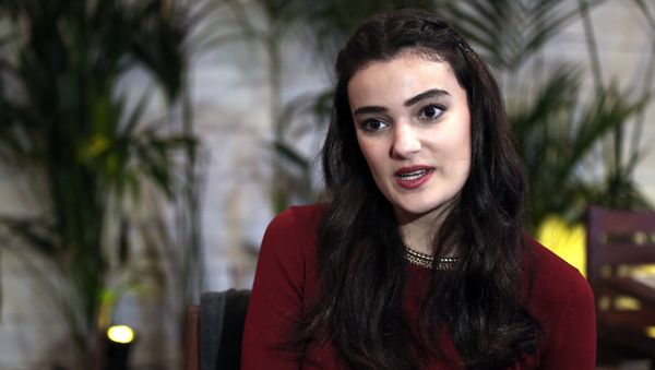 In this Thursday, Feb. 26, 2015 file photo, former Miss Turkey Merve Buyuksarac speaks to The Associated Press in Istanbul, Turkey In this Thursday, Feb. 26, 2015 file photo, former Miss Turkey Merve Buyuksarac speaks to The Associated Press in Istanbul, Turkey - Sputnik International