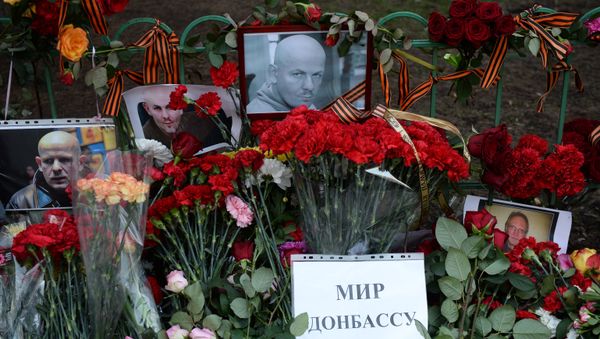 Flowers and candles by Ukrainian embassy in Moscow in memory of journalist Oles Buzina killed in Kiev Flowers and candles by Ukrainian embassy in Moscow in memory of journalist Oles Buzina killed in Kiev - Sputnik International