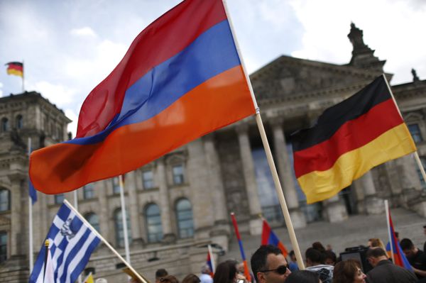 Rally participants wave Armenian and German flags in front of the Reichstag, the seat of the lower house of parliament Bundestag in Berlin, Germany, June 2, 2016, as they protest in favor of the approval of a symbolic resolution by Germany's parliament declaring the 1915 massacre of Armenians by Ottoman forces a genocide Rally participants wave Armenian and German flags in front of the Reichstag, the seat of the lower house of parliament Bundestag in Berlin, Germany, June 2, 2016, as they protest in favor of the approval of a symbolic resolution by Germany's parliament declaring the 1915 massacre of Armenians by Ottoman forces a genocide - Sputnik International
