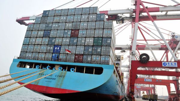 This photo taken on April 12, 2016 shows trucks transporting containers at a port in Qingdao, east China's Shandong province This photo taken on April 12, 2016 shows trucks transporting containers at a port in Qingdao, east China's Shandong province - Sputnik International