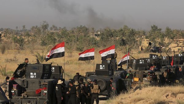 Smoke billows on the horizon as Iraqi military forces prepare for an offensive into Fallujah to retake the city from Islamic State militants in Iraq, Monday, May 30, 2016 - Sputnik International