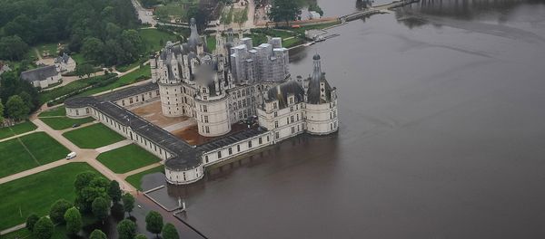 An aerial picture taken on June 2, 2016 shows the castle of Chambord, some 170 kilometers southwest of Paris, and its partly flooded park after the river Cosson went bursting it banks following heavy rainfalls An aerial picture taken on June 2, 2016 shows the castle of Chambord, some 170 kilometers southwest of Paris, and its partly flooded park after the river Cosson went bursting it banks following heavy rainfalls - Sputnik International