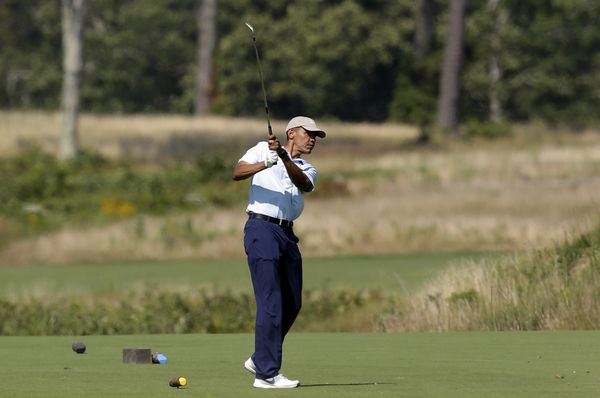 President Barack Obama watches the flight of his ball as he tees off while golfing at Vineyard Golf Club, in Edgartown, Mass President Barack Obama watches the flight of his ball as he tees off while golfing at Vineyard Golf Club, in Edgartown, Mass - Sputnik International