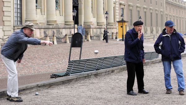 Elderly residents play petanque outside the Royal Castle in Stockholm Elderly residents play petanque outside the Royal Castle in Stockholm - Sputnik International