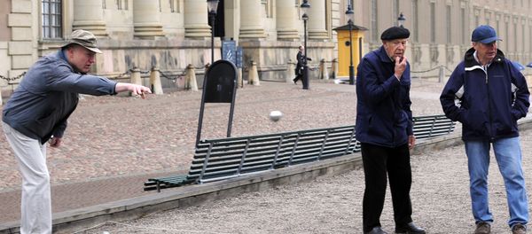 Elderly residents play petanque outside the Royal Castle in Stockholm Elderly residents play petanque outside the Royal Castle in Stockholm - Sputnik International