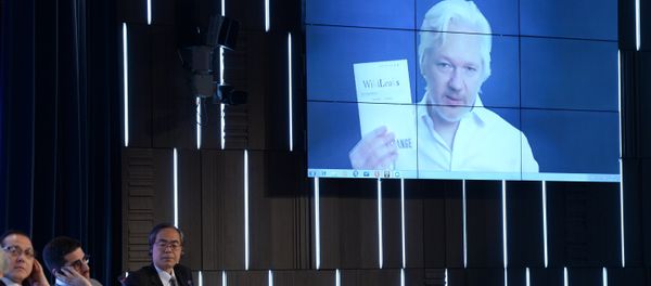 A video link up with Julian Assange, journalist, founder and editor-in-chief of WikiLeaks, at the session, End of the Monopoly: The Open Information Age, held as part of the New Era of Journalism: Farewell to Mainstream international media forum at the Rossiya Segodnya International Multimedia Press Center A video link up with Julian Assange, journalist, founder and editor-in-chief of WikiLeaks, at the session, End of the Monopoly: The Open Information Age, held as part of the New Era of Journalism: Farewell to Mainstream international media forum at the Rossiya Segodnya International Multimedia Press Center - Sputnik International