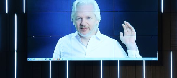 A video link up with Julian Assange, journalist, founder and editor-in-chief of WikiLeaks, at the session, End of the Monopoly: The Open Information Age, held as part of the New Era of Journalism: Farewell to Mainstream international media forum at the Rossiya Segodnya International Multimedia Press Center A video link up with Julian Assange, journalist, founder and editor-in-chief of WikiLeaks, at the session, End of the Monopoly: The Open Information Age, held as part of the New Era of Journalism: Farewell to Mainstream international media forum at the Rossiya Segodnya International Multimedia Press Center - Sputnik International