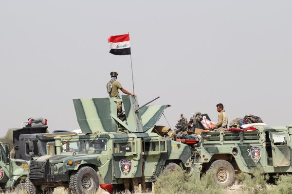 Iraqi security forces sit in military vehicles in suburb of Fallujah, Iraq Iraqi security forces sit in military vehicles in suburb of Fallujah, Iraq - Sputnik International