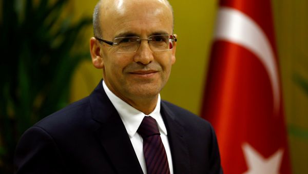 Turkish Deputy Prime Minister Mehmet Simsek poses during an interview with Reuters in Ankara, Turkey. Turkish Deputy Prime Minister Mehmet Simsek poses during an interview with Reuters in Ankara, Turkey. - Sputnik International