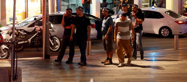 Israeli security personnel secure the area where a shooting attack took place in the center of Tel Aviv. Israeli security personnel secure the area where a shooting attack took place in the center of Tel Aviv. - Sputnik International