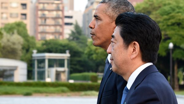 US President Barack Obama (L) and Japanese Prime Minister Shinzo Abe (R) walk towards the Atomic Bomb Dome after laying wreath in the Peace Momorial park in Hiroshima on May 27, 2016 US President Barack Obama (L) and Japanese Prime Minister Shinzo Abe (R) walk towards the Atomic Bomb Dome after laying wreath in the Peace Momorial park in Hiroshima on May 27, 2016 - Sputnik International