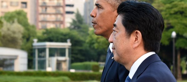 US President Barack Obama (L) and Japanese Prime Minister Shinzo Abe (R) walk towards the Atomic Bomb Dome after laying wreath in the Peace Momorial park in Hiroshima on May 27, 2016 US President Barack Obama (L) and Japanese Prime Minister Shinzo Abe (R) walk towards the Atomic Bomb Dome after laying wreath in the Peace Momorial park in Hiroshima on May 27, 2016 - Sputnik International
