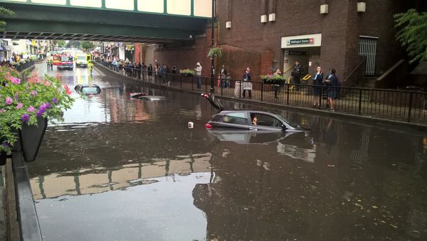 Cars are seen submerged in deep water on a flooded street in London on June 7, 2016, in this handout picture from London Fire Brigade Cars are seen submerged in deep water on a flooded street in London on June 7, 2016, in this handout picture from London Fire Brigade - Sputnik International