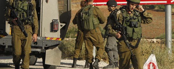 Israeli soldiers are seen at one of the entrances of the Palestinian village of Yatta in the occupied West Bank on June 9,2016 after the army entered the village in search for clues leading to an attack the previous night in the Israeli city of Tel Aviv in which four people were killed and 16 others wounded Israeli soldiers are seen at one of the entrances of the Palestinian village of Yatta in the occupied West Bank on June 9,2016 after the army entered the village in search for clues leading to an attack the previous night in the Israeli city of Tel Aviv in which four people were killed and 16 others wounded - Sputnik International
