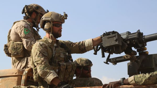 Armed men in uniform identified by Syrian Democratic forces as US special operations forces ride in the back of a pickup truck in the village of Fatisah in the northern Syrian province of Raqa on May 25, 2016 Armed men in uniform identified by Syrian Democratic forces as US special operations forces ride in the back of a pickup truck in the village of Fatisah in the northern Syrian province of Raqa on May 25, 2016 - Sputnik International