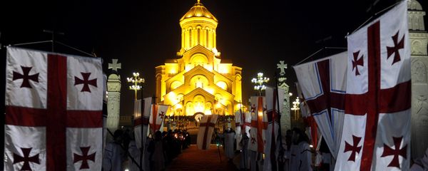 Georgian Orthodox Christians gather in front of the Trinity Cathedral during a Christmas Mass in Tbilisi early on January 7, 2015 Georgian Orthodox Christians gather in front of the Trinity Cathedral during a Christmas Mass in Tbilisi early on January 7, 2015 - Sputnik International
