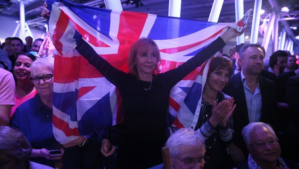A Brexit supporter holds a Union Flag at a Vote Leave rally in London, Britain June 4, 2016. A Brexit supporter holds a Union Flag at a Vote Leave rally in London, Britain June 4, 2016. - Sputnik International