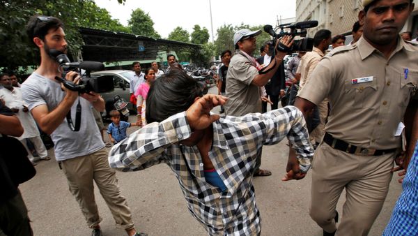 A man convicted for the gang rape of a Danish woman tries to hide his face as he is escorted by a policeman at a court in New Delhi, India, June 9, 2016 A man convicted for the gang rape of a Danish woman tries to hide his face as he is escorted by a policeman at a court in New Delhi, India, June 9, 2016 - Sputnik International