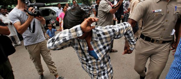 A man convicted for the gang rape of a Danish woman tries to hide his face as he is escorted by a policeman at a court in New Delhi, India, June 9, 2016 A man convicted for the gang rape of a Danish woman tries to hide his face as he is escorted by a policeman at a court in New Delhi, India, June 9, 2016 - Sputnik International