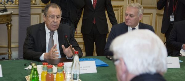 French Foreign Minister Jean-Marc Ayrault (Rear), Russian Foreign Minister Sergei Lavrov (Rear L) and German Foreign Minister Frank-Walter Steinmeier (Front) are pictured before a joint meeting on the situation in Ukraine with their Ukrainian counterpart at the French Foreign Ministry in Paris on March 3, 2016 - Sputnik International