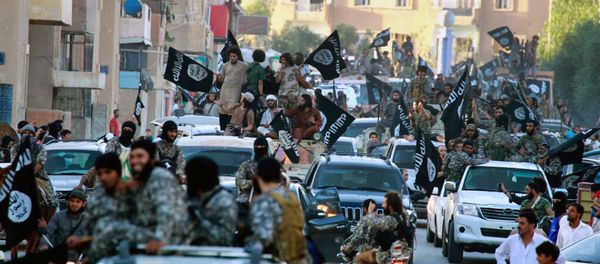 In this undated file image posted on Monday, June 30, 2014, by the Raqqa Media Center of the Islamic State group, a Syrian opposition group, which has been verified and is consistent with other AP reporting, fighters from the Islamic State group parade in Raqqa, north Syria In this undated file image posted on Monday, June 30, 2014, by the Raqqa Media Center of the Islamic State group, a Syrian opposition group, which has been verified and is consistent with other AP reporting, fighters from the Islamic State group parade in Raqqa, north Syria - Sputnik International