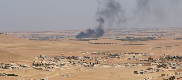 Smoke rises from villages in the southern rural area of Manbij, in Aleppo Governorate, Syria. file photo - Sputnik International