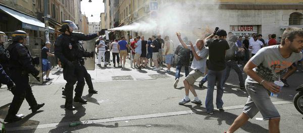Football Soccer - Euro 2016 - England v Russia - Group B - Stade Velodrome, Marseille, France - 11/6/16 Police use teargas on supporters near port of Marseille before the game Football Soccer - Euro 2016 - England v Russia - Group B - Stade Velodrome, Marseille, France - 11/6/16 Police use teargas on supporters near port of Marseille before the game - Sputnik International