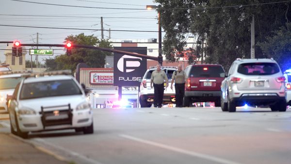 Police cars surround the Pulse Orlando nightclub, the scene of a fatal shooting, in Orlando, Fla., Sunday, June 12, 2016 Police cars surround the Pulse Orlando nightclub, the scene of a fatal shooting, in Orlando, Fla., Sunday, June 12, 2016 - Sputnik International