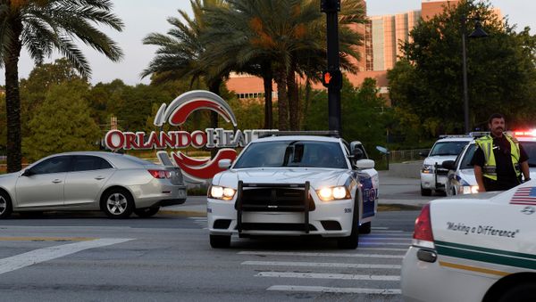 Police lock down Orange Avenue around Pulse nightclub, where people were killed by a gunman in a shooting rampage in Orlando, Florida June 12, 2016 - Sputnik International