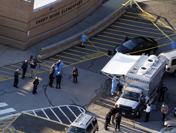 Officials are on the scene outside of Sandy Hook Elementary School in Newtown, Conn., where authorities say a gunman opened fire inside an elementary school in a shooting that left 27 people dead, including 20 children, Friday, Dec. 14, 2012 Officials are on the scene outside of Sandy Hook Elementary School in Newtown, Conn., where authorities say a gunman opened fire inside an elementary school in a shooting that left 27 people dead, including 20 children, Friday, Dec. 14, 2012 - Sputnik International