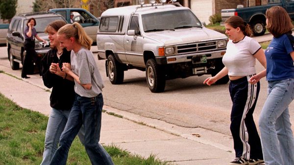 Students from Columbine High School are led away from the facility after two gunmen went on a shooting rampage Tuesday, April 20, 1999, in the southwest Denver suburb of Littleton, Colo. - Sputnik International