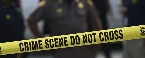 Police stand behind a crime scene tape near the mass shooting at the Pulse nightclub on in Orlando, Florida on June 12, 2016. Police stand behind a crime scene tape near the mass shooting at the Pulse nightclub on in Orlando, Florida on June 12, 2016. - Sputnik International