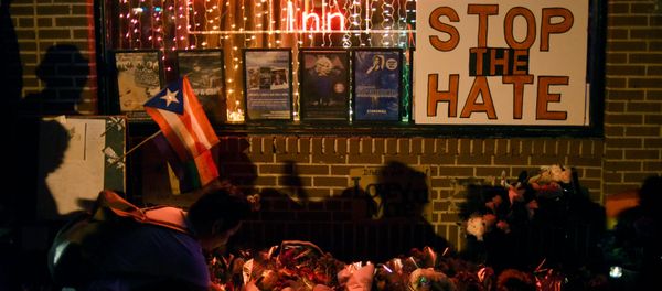 Shadows are cast on a wall as a man lights a candle at a memorial outside The Stonewall Inn on Christopher Street, considered by some as the center of New York State's gay rights movement, following the shooting massacre at Orlando's Pulse nightclub, in the Manhattan borough of New York, U.S., June 12, 2016. Shadows are cast on a wall as a man lights a candle at a memorial outside The Stonewall Inn on Christopher Street, considered by some as the center of New York State's gay rights movement, following the shooting massacre at Orlando's Pulse nightclub, in the Manhattan borough of New York, U.S., June 12, 2016. - Sputnik International