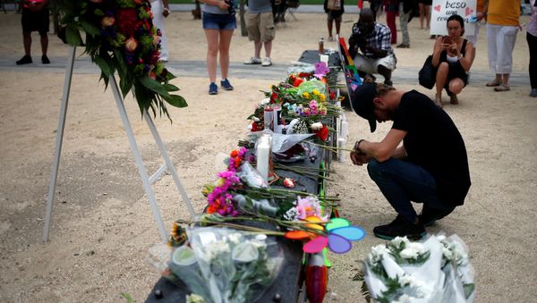 Bryant Woernley prays for the deceased ahead of a candle light vigil in memory of victims one day after a mass shooting at the Pulse gay night club in Orlando, Florida, U.S., June 13, 2016. Bryant Woernley prays for the deceased ahead of a candle light vigil in memory of victims one day after a mass shooting at the Pulse gay night club in Orlando, Florida, U.S., June 13, 2016. - Sputnik International