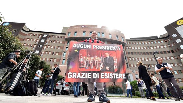 A man holds a banner reading All the best president, thanks for existing in front of San Raffaele hospital, as Italian surgeons begin a four-hour heart operation on former prime minister Silvio Berlusconi on Tuesday to replace a defective aortic valve, a hospital statement said, in Milan, Italy June 14, 2016. A man holds a banner reading All the best president, thanks for existing in front of San Raffaele hospital, as Italian surgeons begin a four-hour heart operation on former prime minister Silvio Berlusconi on Tuesday to replace a defective aortic valve, a hospital statement said, in Milan, Italy June 14, 2016. - Sputnik International