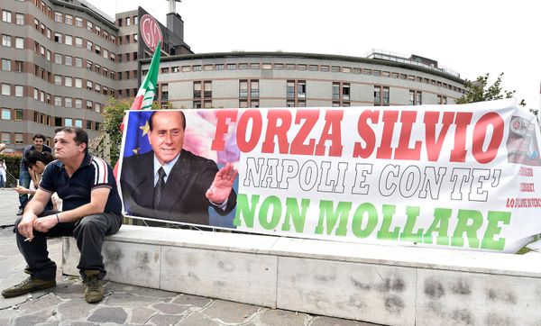A man sits next to a banner reading Come on Silvio, Naples is with you, never give up in front of San Raffaele hospital, as Italian surgeons begin a four-hour heart operation on former prime minister Silvio Berlusconi on Tuesday to replace a defective aortic valve, a hospital statement said, in Milan, Italy June 14, 2016. A man sits next to a banner reading Come on Silvio, Naples is with you, never give up in front of San Raffaele hospital, as Italian surgeons begin a four-hour heart operation on former prime minister Silvio Berlusconi on Tuesday to replace a defective aortic valve, a hospital statement said, in Milan, Italy June 14, 2016. - Sputnik International