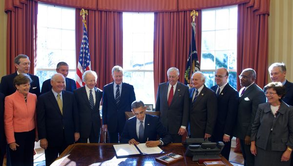 US President Barack Obama signs H.R. 6156, the Russia and Moldova Jackson-Vanik Repeal and Sergei Magnitsky Rule of Law Accountability Act. (File) - Sputnik International