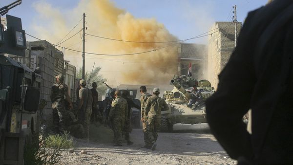 In this Tuesday, June 14, 2016 photo, smoke rises after an airstrike by a US-led coalition warplane as Iraqi security forces advance their position during heavy fighting against Islamic State militants in Fallujah, Iraq - Sputnik International