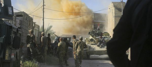 In this Tuesday, June 14, 2016 photo, smoke rises after an airstrike by a US-led coalition warplane as Iraqi security forces advance their position during heavy fighting against Islamic State militants in Fallujah, Iraq In this Tuesday, June 14, 2016 photo, smoke rises after an airstrike by a US-led coalition warplane as Iraqi security forces advance their position during heavy fighting against Islamic State militants in Fallujah, Iraq - Sputnik International