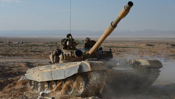 A T-72 tank of the Fatimiyoun Brigade at the frontline in the mountains 10 km from Palmyra - Sputnik International
