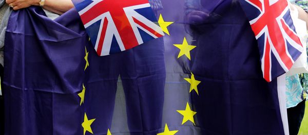 People hold Union Flags and the EU flag at a kiss chain event organised by pro-Europe 'remain' campaigners seeking to avoid a Brexit in the EU referendum in Parliament Square in front of the Houses of Parliament in central London on June 19, 2016. People hold Union Flags and the EU flag at a kiss chain event organised by pro-Europe 'remain' campaigners seeking to avoid a Brexit in the EU referendum in Parliament Square in front of the Houses of Parliament in central London on June 19, 2016. - Sputnik International