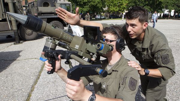 Two soldiers of the Austrian Army antiaircraft defense regiment pose with a Mistral antiaircraft guided missile Two soldiers of the Austrian Army antiaircraft defense regiment pose with a Mistral antiaircraft guided missile - Sputnik International