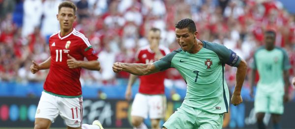 Football Soccer - Hungary v Portugal - EURO 2016 - Group F - Stade de Lyon, Lyon, France - 22/6/16 Portugal's Cristiano Ronaldo in action with Hungary's Krisztian Nemeth Football Soccer - Hungary v Portugal - EURO 2016 - Group F - Stade de Lyon, Lyon, France - 22/6/16 Portugal's Cristiano Ronaldo in action with Hungary's Krisztian Nemeth - Sputnik International