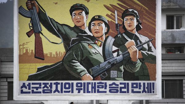 A North Korean man and woman walk under a mural with a message which reads Long live the great victory of the army-first policy in the city center of Wonsan on Wednesday, June 22, 2016, in Wonsan, North Korea. A North Korean man and woman walk under a mural with a message which reads Long live the great victory of the army-first policy in the city center of Wonsan on Wednesday, June 22, 2016, in Wonsan, North Korea. - Sputnik International