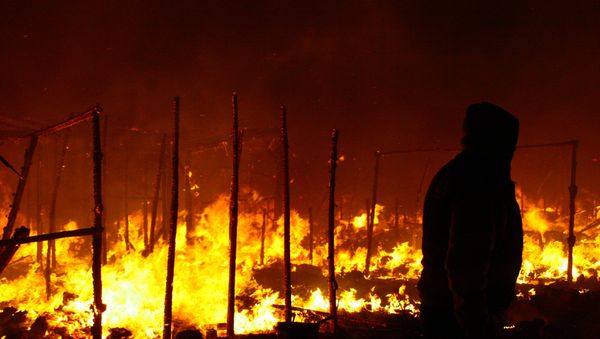 When fires happen in the ‘Jungle’, it’s like we are burning in Hell. They happen quite often as people use candles as they can’t afford gas to keep warm - Habibi, 24, Afghanistan. - Sputnik International