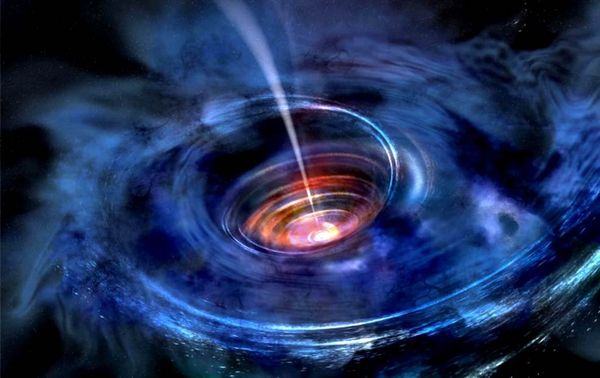 In this artist's rendering, a thick accretion disk has formed around a supermassive black hole following the tidal disruption of a star that wandered too close.  - Sputnik International
